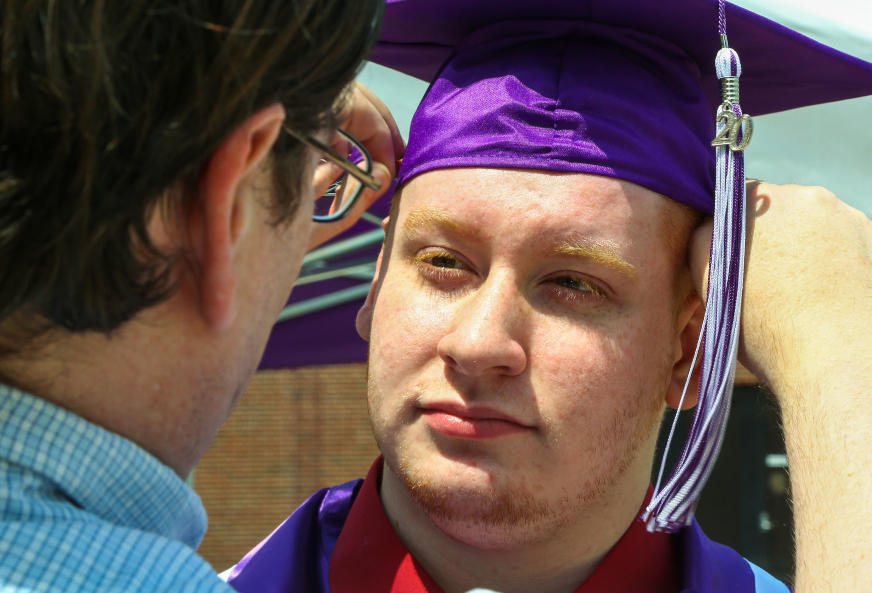 Merrillville High School seniors participate in a "drive-up" graduation